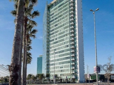 Loft para locação no bairro cristal, com aproximadamente 43m² de área privativa, junto ao barra shopping sul, dormitório e living integrados com split e ventilador de teto, cozinha americana, área de