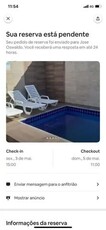 casa com piscina aquecida e churrasqueira em Praia Grande