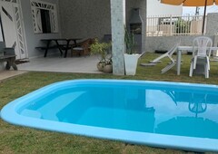 Casa com piscina em Frente à Praia em condomínio f
