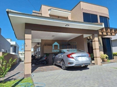 Casa de alto padrão, 3 suítes e piscina à venda, 290 m² por r$ 1.590.000 - condomínio marítimo - tramandaí/rs