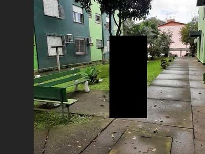 2 dormitórios com sala e cozinha integradas, garagem privativa! Condomínio, agua e IPTU in