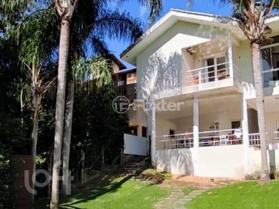 Casa 3 dorms à venda Estrada Haroldo Soares Glavan, Cacupé - Florianópolis