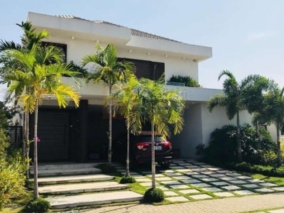 Excelente casa à venda no condomínio alphaville barra da tijuca de 789m² com 5 suítes sala para 4 ambientes piscina sauna 4 vagas de garagem