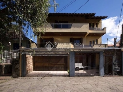 Casa em condomínio fechado com 4 quartos à venda na rua pinto da rocha, 383, partenon, porto alegre, 250 m2 por r$ 890.000