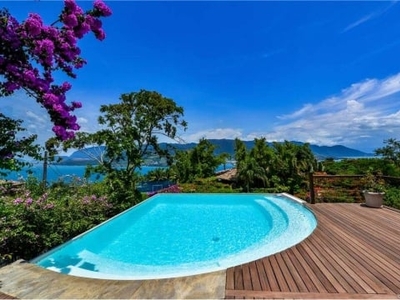 Casa com piscina climatizada, vista mar em ilhabela, escritura definitiva.