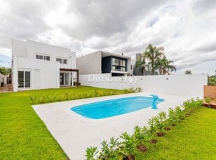 Casa em condomínio fechado com 4 quartos à venda na avenida juca batista, 8000, belém novo, porto alegre por r$ 1.830.000