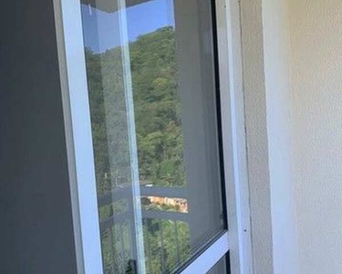 Aconchegante e iluminado apartamento de 2 dorms à venda na Nova Cintra em Santos - SP