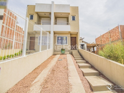 Casa 2 dorms à venda Rua Doutor Sérgio de Figueiredo, Guarujá - Porto Alegre