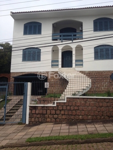 Casa 4 dorms à venda Rua Alcebíades Antônio dos Santos, Nonoai - Porto Alegre