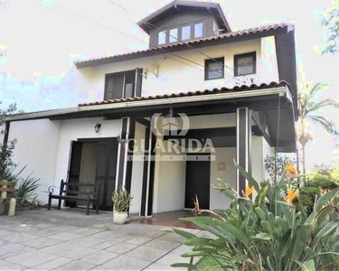 Casa em Condomínio para comprar no bairro Cavalhada - Porto Alegre com 3 quartos