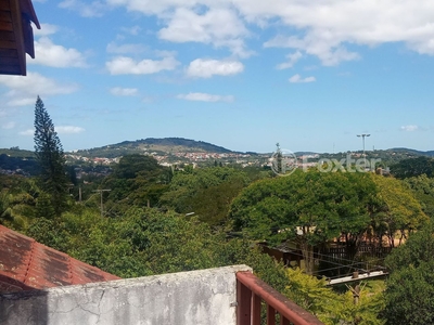 Casa em Condomínio 3 dorms à venda Avenida Eduardo Prado, Cavalhada - Porto Alegre