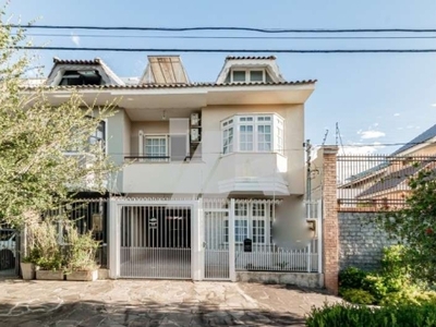 Casa com 3 quartos à venda na avenida joão carlos bertussi da silva, 49, jardim itu sabará, porto alegre, 146 m2 por r$ 690.000
